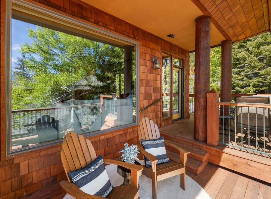 Enjoy the tranquility of this stunning property featuring a cozy outdoor seating area.