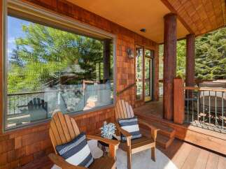Enjoy the tranquility of this stunning property featuring a cozy outdoor seating area.