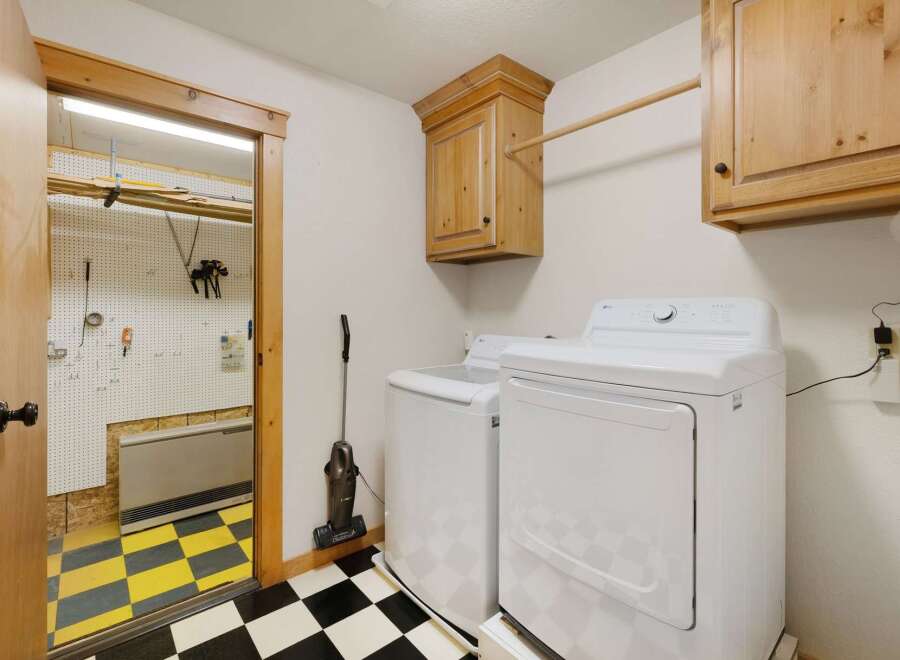This laundry room offers a blend of functionality and style.