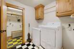 This laundry room offers a blend of functionality and style.
