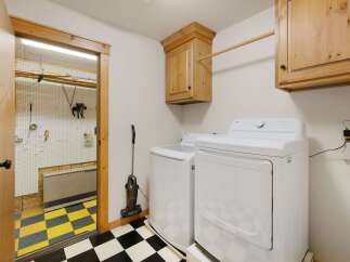 This laundry room offers a blend of functionality and style.