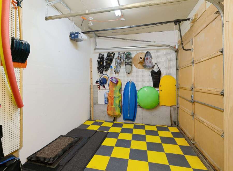 This well-organized garage offers ample storage solutions for your belongings.
