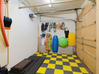 This well-organized garage offers ample storage solutions for your belongings.