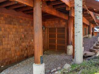 This stunning property showcases exquisite craftsmanship and natural beauty.