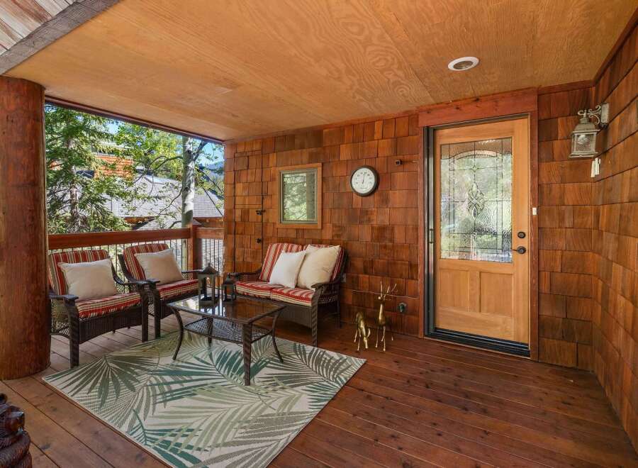 Step into a cozy outdoor haven with this inviting porch.