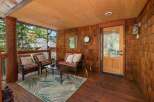 Step into a cozy outdoor haven with this inviting porch.