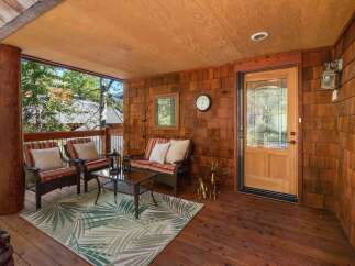 Step into a cozy outdoor haven with this inviting porch.