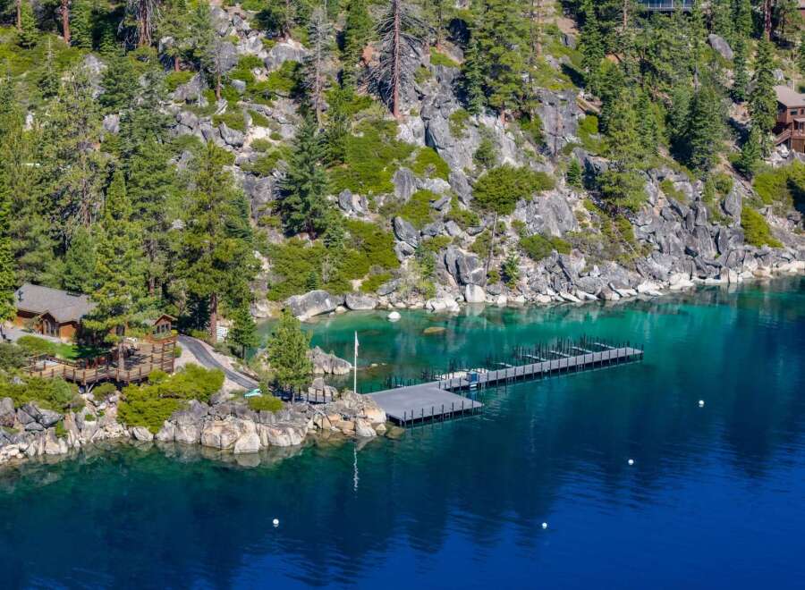 Discover a stunning waterfront property nestled amidst the serene beauty of nature.