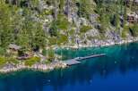 Discover a stunning waterfront property nestled amidst the serene beauty of nature.