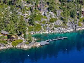 Discover a stunning waterfront property nestled amidst the serene beauty of nature.