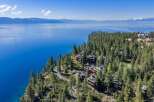 Nestled on a stunning cliffside, this property offers breathtaking views of the serene lake and surrounding mountains.