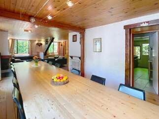 This stunning property boasts a spacious dining area, perfect for hosting gatherings.