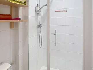 Step into a modern bathroom with a sleek glass shower enclosure.