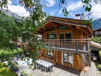 Escape to the mountains in this stunning wooden chalet, perfect for a luxurious getaway.