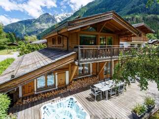 Escape to the mountains in this stunning wooden chalet, offering a luxurious retreat with breathtaking views.