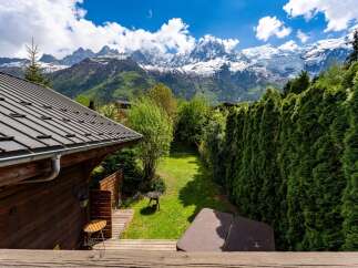 Escape to the mountains with this stunning property! Enjoy breathtaking views of snow-capped peaks and lush greenery from your private deck.