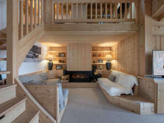 This stunning property boasts a cozy living area with a fireplace, perfect for relaxing evenings.