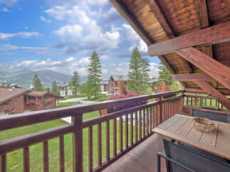 Enjoy breathtaking mountain views from this charming balcony.