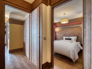 Step into luxury with this stunning property featuring exquisite wooden accents throughout.