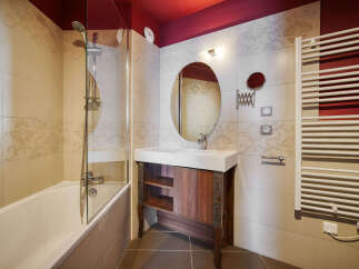 This elegant bathroom features a stylish vanity with a sleek countertop and ample storage.