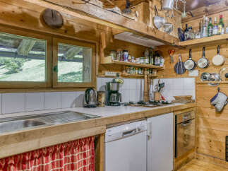 Step into the rustic charm of this cozy kitchen, perfect for creating memorable meals.