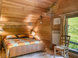 Step into a cozy bedroom retreat with rustic charm.