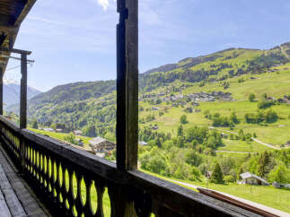 Experience breathtaking mountain views from this charming property.