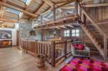 Step into rustic luxury with this stunning property, showcasing exquisite wooden architecture and a cozy ambiance.