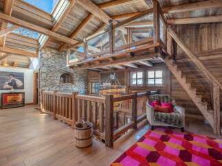 Step into rustic luxury with this stunning property, showcasing exquisite wooden architecture and a cozy ambiance.