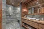Experience rustic luxury in this stunning bathroom.