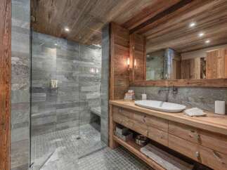 Experience rustic luxury in this stunning bathroom.