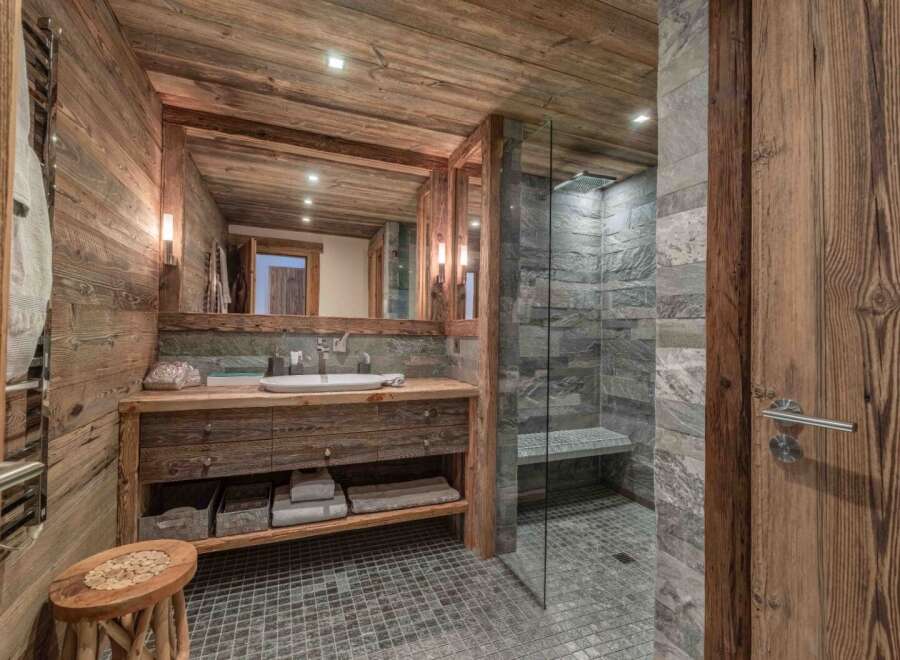 Experience rustic luxury in this stunning bathroom.