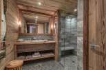Experience rustic luxury in this stunning bathroom.