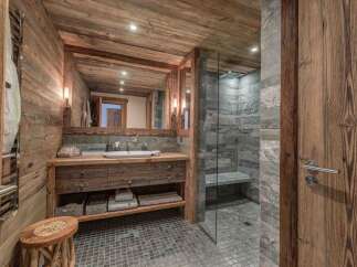 Experience rustic luxury in this stunning bathroom.