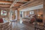 Experience the epitome of luxury in this stunning bedroom, featuring exquisite wooden accents and a cozy ambiance.