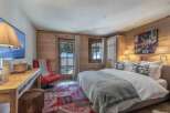 This cozy bedroom features a rustic wooden interior, creating a warm and inviting atmosphere.