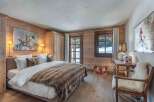 Experience the epitome of rustic luxury in this stunning bedroom.