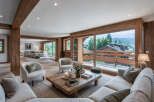 Experience luxury living in this stunning property, featuring a spacious living area with natural wood accents and large windows that offer breathtaking views.