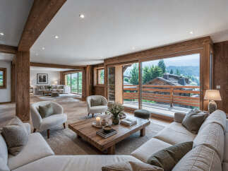 Experience luxury living in this stunning property, featuring a spacious living area with natural wood accents and large windows that offer breathtaking views.