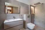This modern bathroom features sleek design elements and high-end finishes.