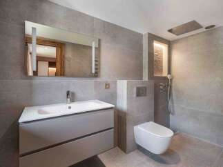 This modern bathroom features sleek design elements and high-end finishes.