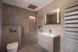 Step into a modern bathroom oasis, featuring sleek design elements and luxurious finishes.