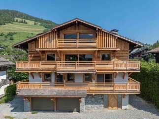 This stunning wooden chalet offers a perfect blend of rustic charm and modern elegance.