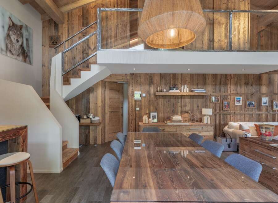This stunning property boasts a rustic charm with its wooden paneling and exposed beams, creating a warm and inviting atmosphere.