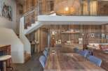 This stunning property boasts a rustic charm with its wooden paneling and exposed beams, creating a warm and inviting atmosphere.