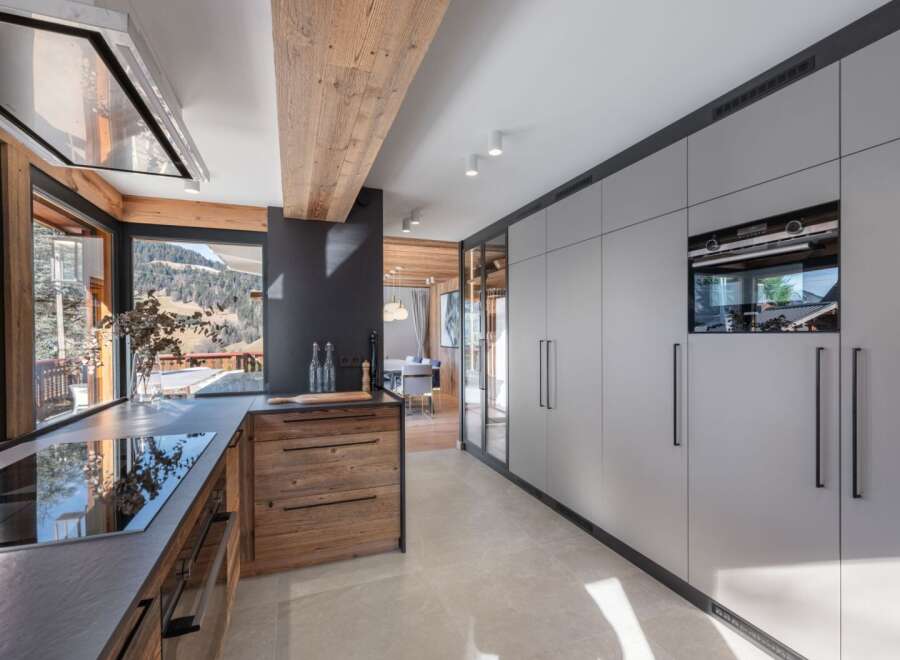 Experience luxury living in this stunning kitchen, featuring a modern design with high-end appliances.