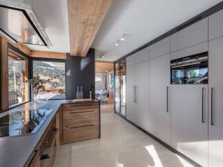 Experience luxury living in this stunning kitchen, featuring a modern design with high-end appliances.
