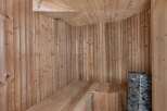 Step into relaxation with this stunning sauna.