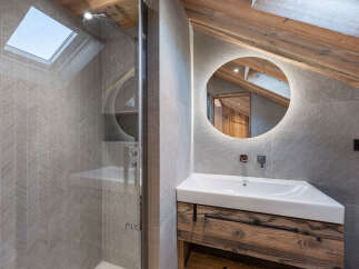 This stunning bathroom features a modern design with rustic elements.