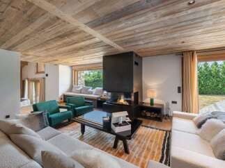 Experience luxury living in this stunning property featuring a modern fireplace and a cozy seating area.